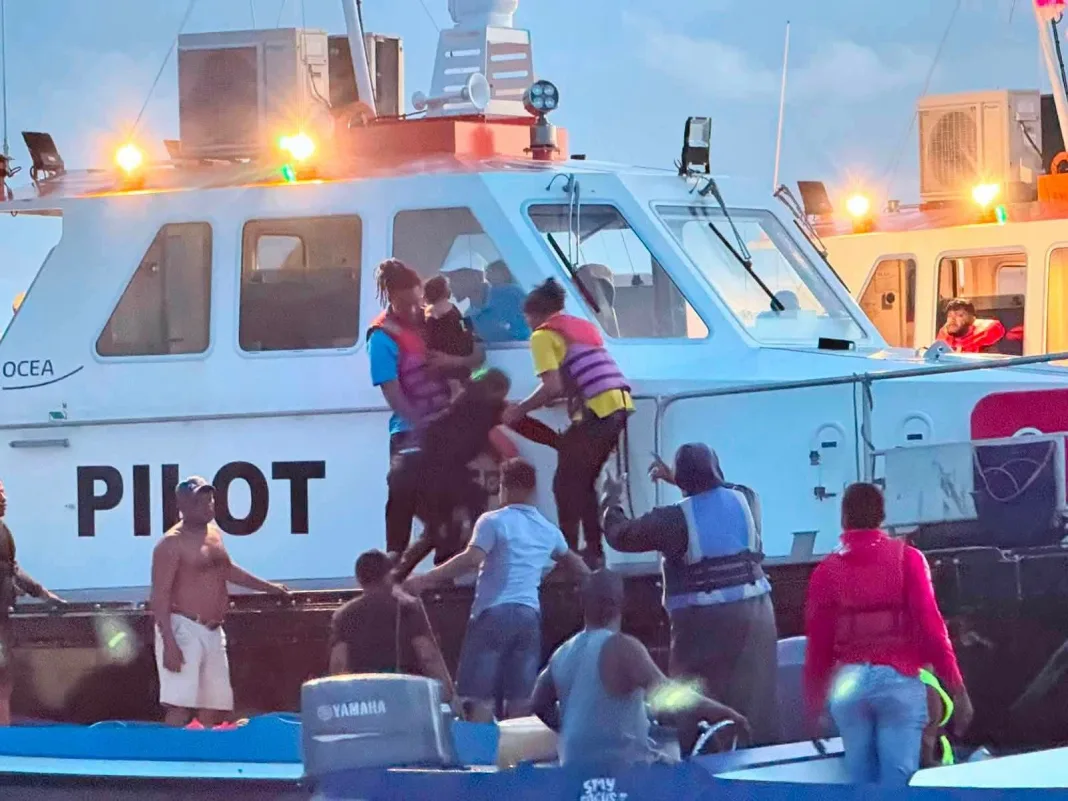Dozens rescued after Guyana ferry overturns, search continues.