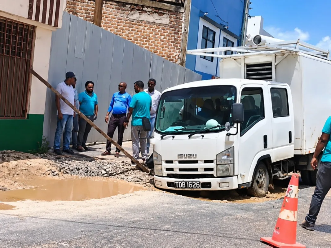 WASA truck gets stuck while navigating badly damaged roadway