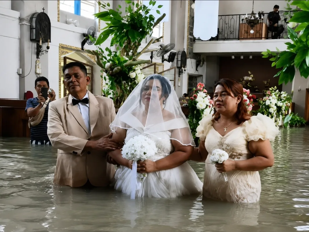 Bride and Groom Marry at Flooded Church Despite Rising Dangers