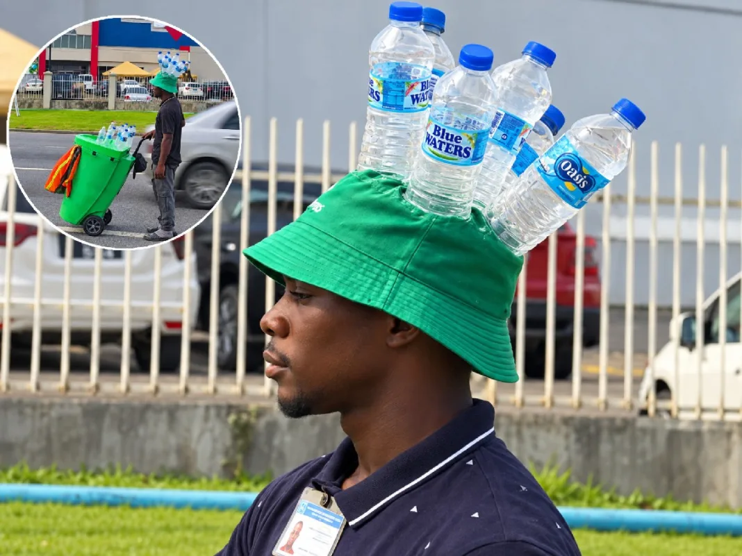 Piarco Water Vendor Gets Attention With Creative Bottle Hat